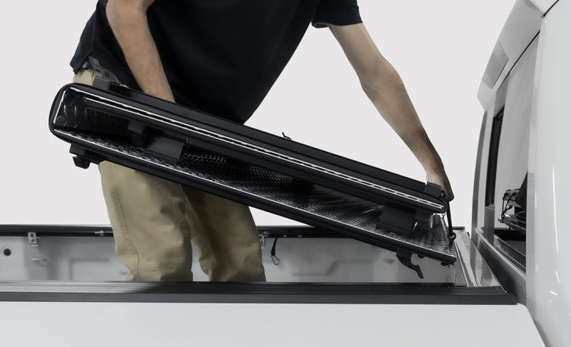 Access LOMAX 2022+ Rivian R1T 4ft 6in Bed (w/ OEM Tonneau Track) Folding Hard Cover - Black Urethane
