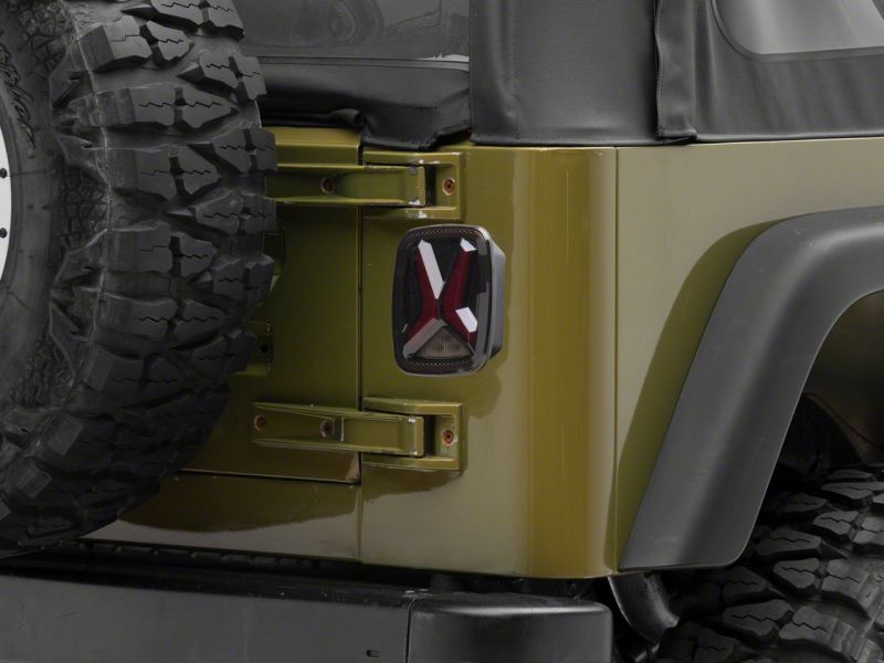 Raxiom 76-06 Jeep CJ7 Wrangler YJ & TJ Gladiator LED Tail Lights- Black Housing (Smoked Lens)