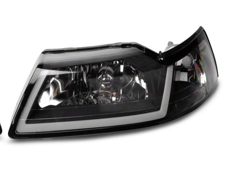 Raxiom 99-04 Ford Mustang Axial Series Headlights w/ LED Bar- Black Housing (Clear Lens)