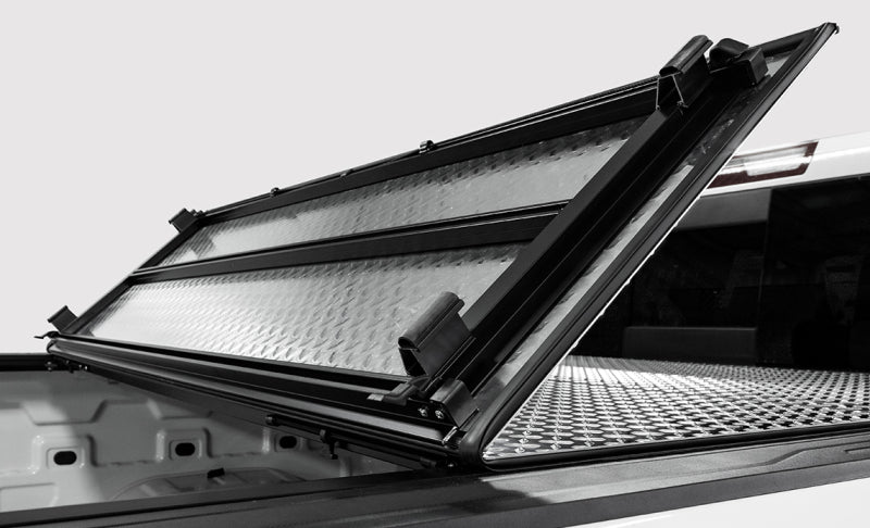 Access LOMAX 2022+ Rivian R1T 4ft 6in Bed (w/ OEM Tonneau Track) Folding Hard Cover - Black Urethane