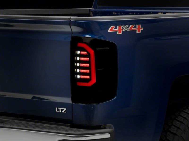 Raxiom 14-18 Chevrolet Silverado 1500 Axial Series LED Tail Lights- Black Housing (Smoked Lens)