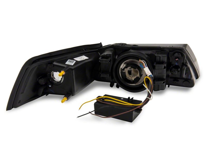 Raxiom 99-04 Ford Mustang Axial Series Headlights w/ Sequential LED Bar- Black Housing (Clear Lens)