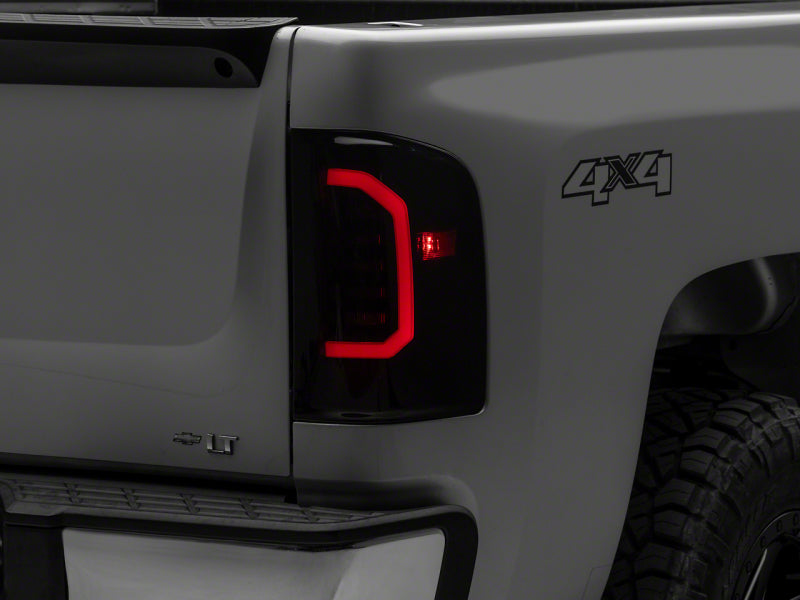 Raxiom 07-14 Chevrolet Silverado 1500 Axial Series LED Tail Lights- Black Housing (Smoked Lens)