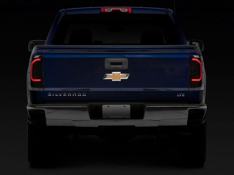 Raxiom 14-18 Chevrolet Silverado 1500 Axial Series LED Tail Lights- Black Housing (Smoked Lens)