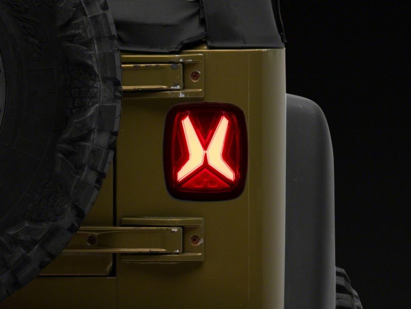 Raxiom 76-06 Jeep CJ7 Wrangler YJ & TJ Gladiator LED Tail Lights- Black Housing (Smoked Lens)