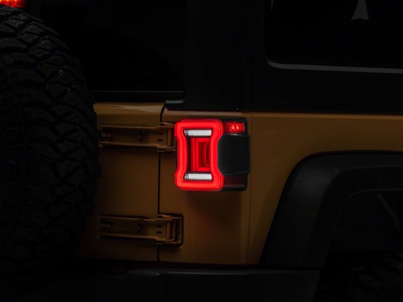Raxiom 07-18 Jeep Wrangler JK Axial Series JL Style LED Tail Lights- Black Housing- Red Lens