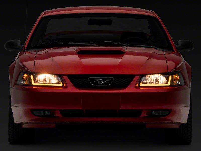 Raxiom 99-04 Ford Mustang Axial Series Headlights w/ Sequential LED Bar- Black Housing (Clear Lens)
